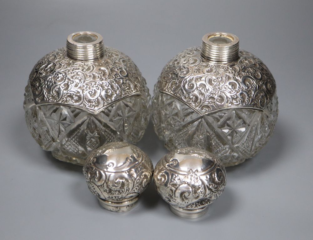 A pair of Edwardian repousse silver-mounted globular glass scent bottles, J.H. Worrel, Son & Co Ltd, Birmingham, 1907